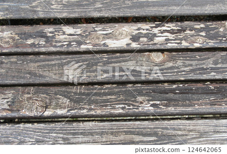 Deep colored wooden bench planks 124642065