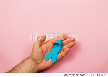Blue ribbon symbolizes awareness for prostate cancer and early detection Blue ribbon symbolizes awareness for prostate cancer and early detection 124642364
