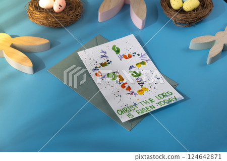 Handmade painted greeting card with message CHRIST THE LORD IS RISEN TODAY written in beautiful handwriting. Gesture shows excitement and joy for the upcoming event. Springtime holiday gift present Handmade painted greeting card with message CHRIST THE LORD IS RISEN TODAY written in beautiful handwriting. Gesture shows excitement and joy for the upcoming event. Springtime holiday gift present 124642871