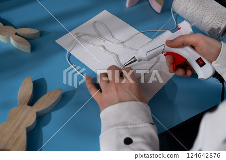 Easter bunny made of rope using hot glue Reindeer fingerprints Sustainable Christmas preparation Diy process of making handmade greeting cards. Step by step activity for children. Inclusive and 124642876