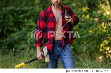 Lumberjack axe. Man with logging axe in checkered shirt. Hardworking brutal man. Lumberjack hardworking outdoor. Brutal lumberjack. Brutality and masculinity. Lumberjack man with axe, cropped view 124642943