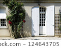 White window, red flower 124643705