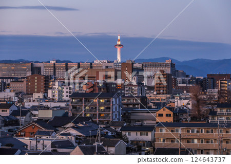 Evening view of Kyoto city with the illuminated Kyoto Tower Evening view of Kyoto city with the illuminated Kyoto Tower 124643737