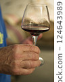 Male hand holding wine 124643989
