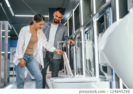 Two people is in the store of goods for the home 124645298