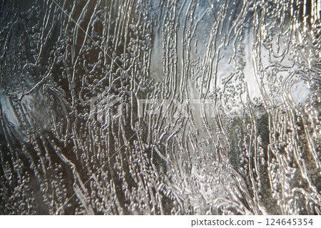 Detailed background texture of fresh thin ice. 124645354