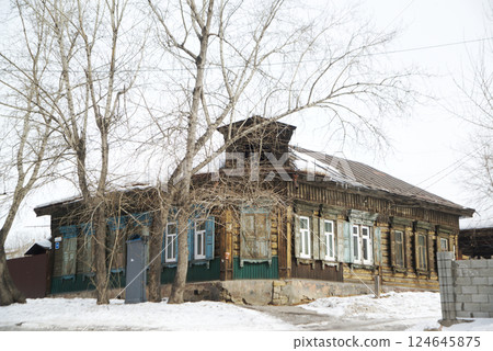 Old-style houses with distinctive windows can be found everywhere in Irkutsk city. Old-style houses with distinctive windows can be found everywhere in Irkutsk city. 124645875