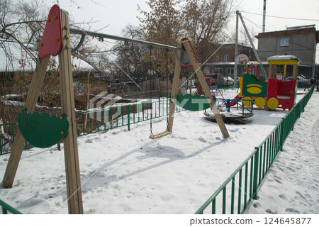 Playground that is densely covered with snow in winter at Irkutsk Oblast, Russia. Playground that is densely covered with snow in winter at Irkutsk Oblast, Russia. 124645877