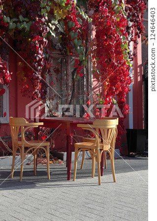 Outdoor cafe in autumn. Street photography. Outdoor cafe in autumn. Street photography. 124646403