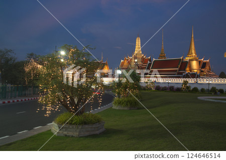 Beautiful lights decorate Wat Phra Kaew at sunset. This is a place of respect and tourism for Buddhists around the world. Located at Bangkok city in Thailand. Beautiful lights decorate Wat Phra Kaew at sunset. This is a place of respect and tourism for Buddhists around the world. Located at Bangkok city in Thailand. 124646514