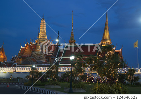 Beautiful lights decorate Wat Phra Kaew at sunset. This is a place of respect and tourism for Buddhists around the world. Located at Bangkok city in Thailand. Beautiful lights decorate Wat Phra Kaew at sunset. This is a place of respect and tourism for Buddhists around the world. Located at Bangkok city in Thailand. 124646522