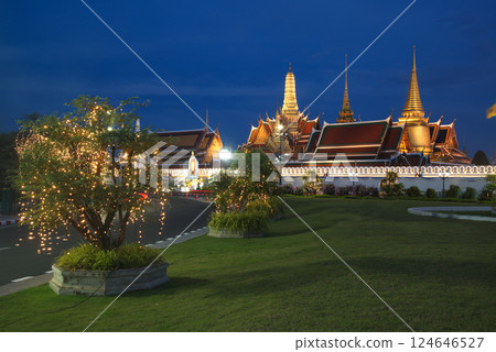 Beautiful lights decorate Wat Phra Kaew at sunset. This is a place of respect and tourism for Buddhists around the world. Located at Bangkok city in Thailand. 124646527