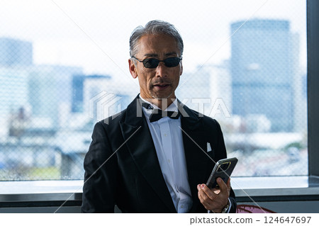 A CEO venting his anger over the phone in his office in an office building 124647697