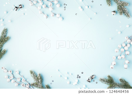 Christmas composition with fir branches and decorations on blue background. Flat lay, New Year frame. Christmas composition with fir branches and decorations on blue background. Flat lay, New Year frame. 124648456