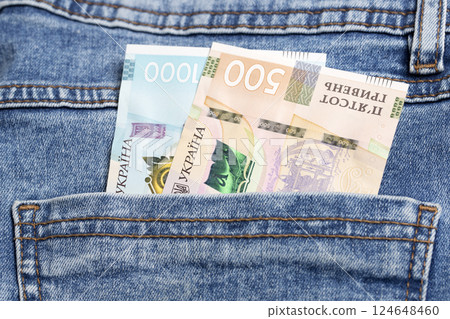 Ukrainian hryvnia in the pocket of blue jeans 124648460