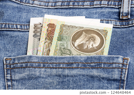 Old Russian ruble in the pocket of blue jeans 124648464