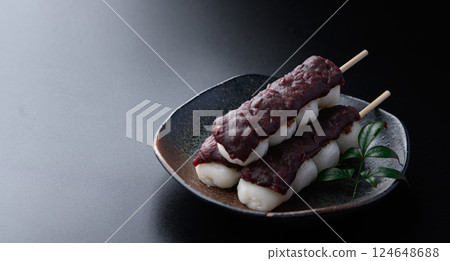 Japanese sweets Kushidango (Bean paste) on a black background 124648688