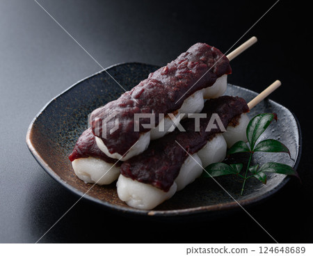 Japanese sweets Kushidango (Bean paste) on a black background 124648689