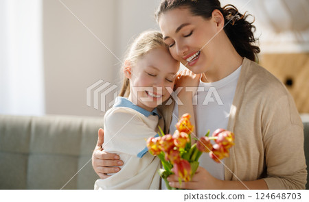 daughter and mom with flowers 124648703