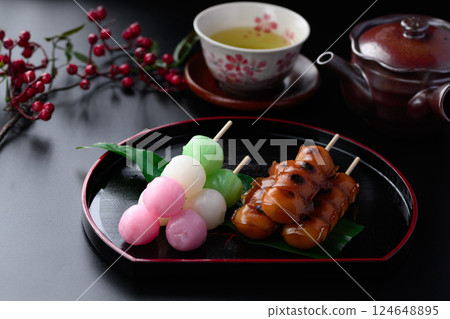 Two types of skewers (Japanese sweets) Mitarashi dango Three-color dango Two types of skewers (Japanese sweets) Mitarashi dango Three-color dango 124648895