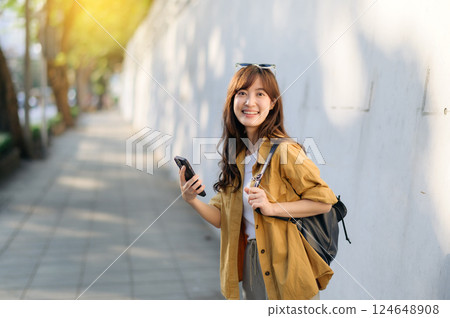 Traveler young asian woman in her 30s documents her unique Bangkok journey online. Be inspired by her adventures and discover your own. 124648908