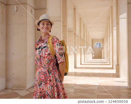 Young female tourist exploring iconic landmarks of the United Arab Emirates. Young female tourist exploring iconic landmarks of the United Arab Emirates. 124650038