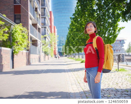 Tourist woman explores modern Frankfurt, Tourist woman explores modern Frankfurt, 124650059