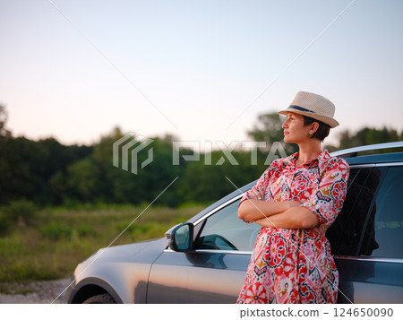 Traveler woman drives car through scenic countryside of Croatia Traveler woman drives car through scenic countryside of Croatia 124650090