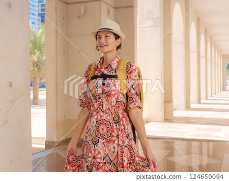 Young female tourist exploring iconic landmarks of the United Arab Emirates. 124650094