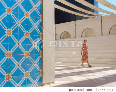 Young female tourist exploring iconic landmarks of the United Arab Emirates. 124650095