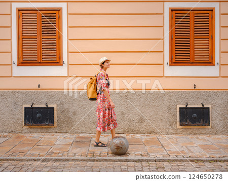 Woman Walking Through the Historic Center of Varazdin 124650278