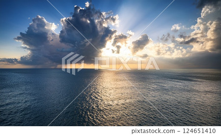 Beautiful seascape with sunlight shining through the clouds 2 124651410