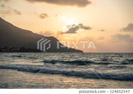 Scenic sunset and coastal view at Beau Vallon beach in Seychelles, featuring waves Scenic sunset and coastal view at Beau Vallon beach in Seychelles, featuring waves 124652547