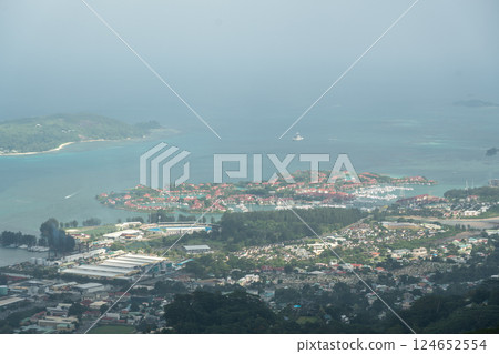 Panoramic view from Dans Gallas Trail over Eden Island, marina, and Victoria city with yachts 124652554