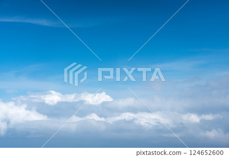 Blue Sky with White Clouds, Flying above Sunny Cloudy Sky Texture Pattern Plane View Blue Sky with White Clouds, Flying above Sunny Cloudy Sky Texture Pattern Plane View 124652600