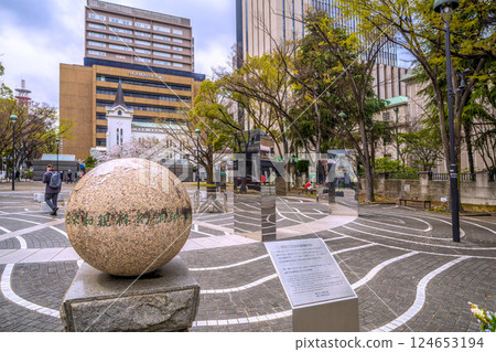 Yokohama cityscape in Japan: View of Yokohama Kaigan Church and the site of the signing of the Treaty of Peace and Amity between the United States and Japan from the Port Opening Square 124653194