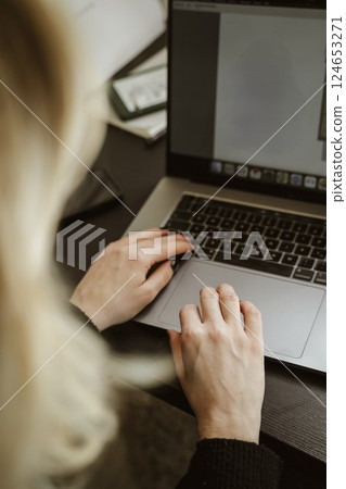 Hands Typing on Laptop Keyboard in Home Office Hands Typing on Laptop Keyboard in Home Office 124653271