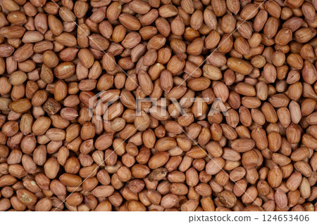 Raw brown peanuts close-up view from above 124653406