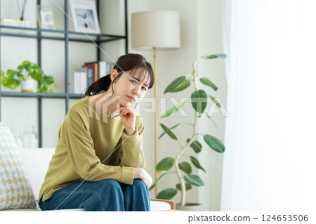 Young woman suffering in the living room 124653506