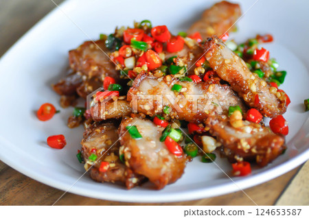 stir fried pork or deep fried pork , fried pork or crispy pork stir fried pork or deep fried pork , fried pork or crispy pork 124653587