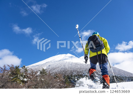 Snowshoe trekking image with Mt. Oyama in the background 124653669