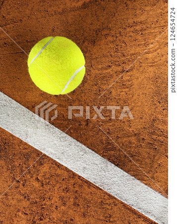 Tennis Ball on a Clay Court, Top Down View Tennis Ball on a Clay Court, Top Down View 124654724