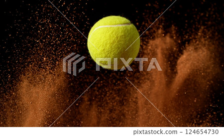 Freeze Motion Detail Shot of Flying Tennis Ball with Clay Explosion Freeze Motion Detail Shot of Flying Tennis Ball with Clay Explosion 124654730