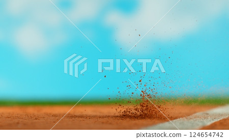 Freeze Motion Detail Shot of Tennis Ball Hitting a Clay Court 124654742