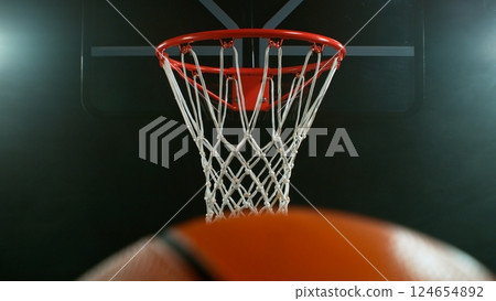 Freeze motion of basketball ball hitting the basket Freeze motion of basketball ball hitting the basket 124654892