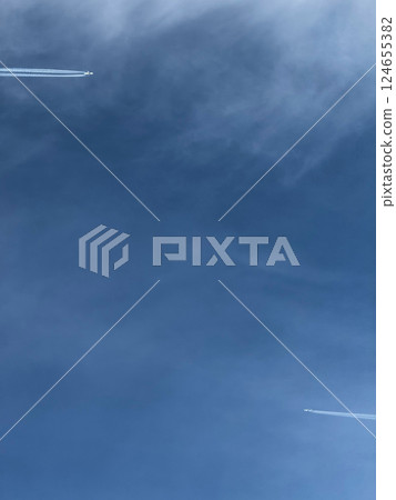 Two Airplanes Flying in Clear Blue Sky 124655382