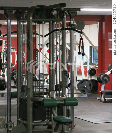 Fitness Center With Various Workout Stations and Equipment Setup 124655730