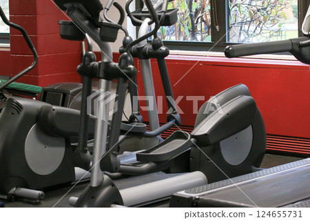 Fitness Equipment Arranged in a Bright Gym With Natural Light 124655731