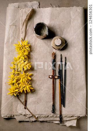 Artistic Workspace With Yellow Flowers 124656301