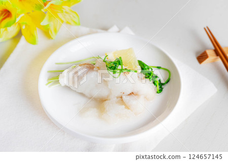 Early spring dish: cod stewed in grated radish 124657145